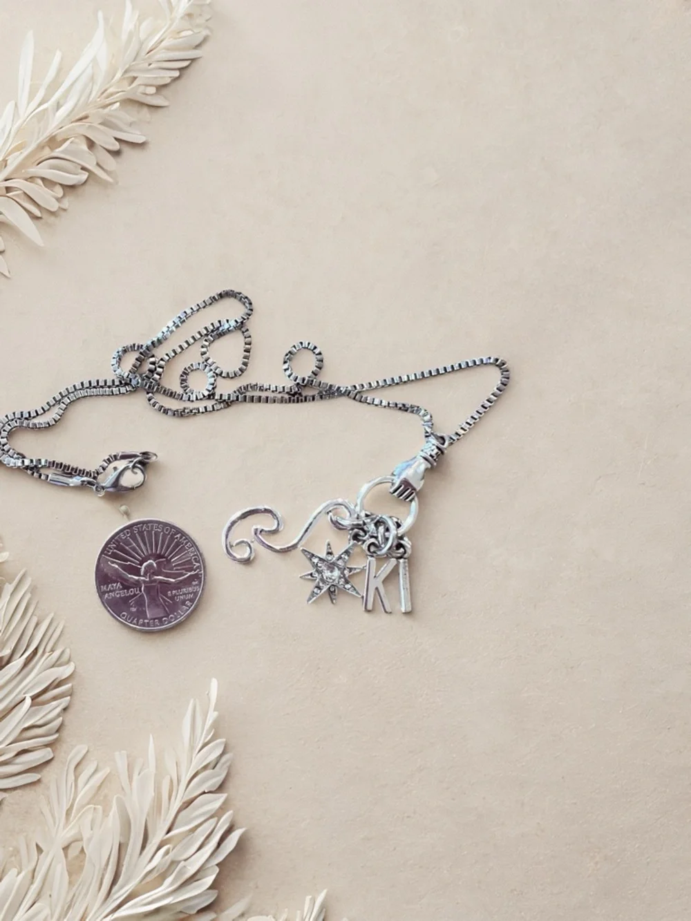 Monk DND necklace with the wind, a star, and KI Dungeons and Dragons jewelry
